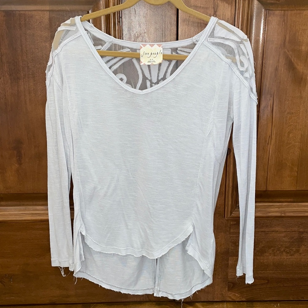 Super cute long sleeve Free people top with a back lace style design